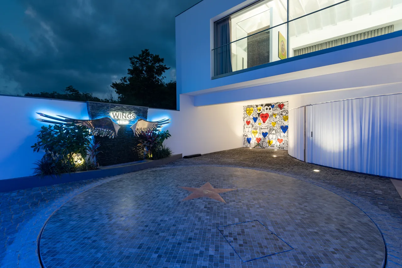 The villa entrance and its glowing sign
